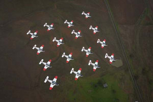 Sixteen Pacific Aerospace CT-4B Airtrainer aircraft from the Basic Flying Training School fly in formation over Tamworth.Credit: Defence