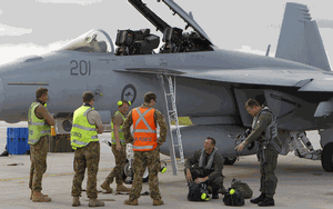 RAAF No. 1 Squadron maintenance crew engage in conversation with the aircrew of the 1SQN F/A-18F Super Hornet during Exercise Cope North, Guam 2012.