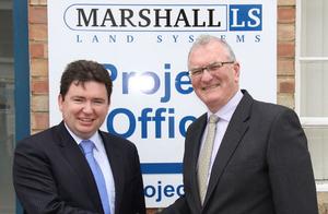 Iain Watt being welcomed by Peter Callaghan.