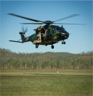 An Australian Army MRH90 helicopter from Battlegroup Griffin takes off after picking up VIPs during Exercise Hamel 2015. Credit: Defence