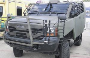 Plasan's Ultra Flex Fence textile RPG armour fitted to an Oshkosh Sand Cat.