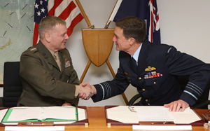 US Vice Chairman of the Joint Chiefs of Staff General Cartwright (left) and Australian Chief of the Defence Force Air Chief Marshal Houston at the signing of the Australia-US Acquisition and Cross-Servicing Agreement in Canberra.