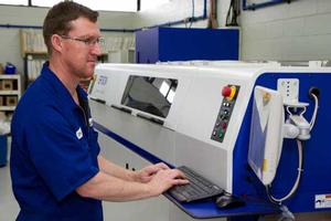 SurePress operator Tim Radcliffe at work on Admark's new short run printer from Epson.