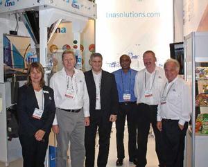 Staff from Australia's tna celebrate the opening of its office in Johannesburg, South Africa, at the recent Propak Africa show.