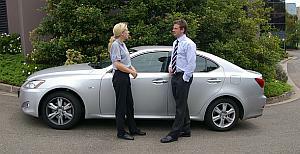 Kendra Waddams, 1Car1 rental assistant with 1Car1 MD James Frape and rental car.