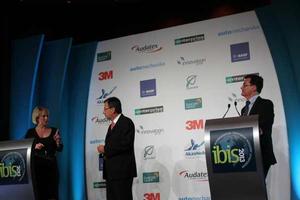 Suncorp's Terese Wood answers question from conference facilitator David Lingham, Craig Summers acting head of Suncorp motor claims on right.
