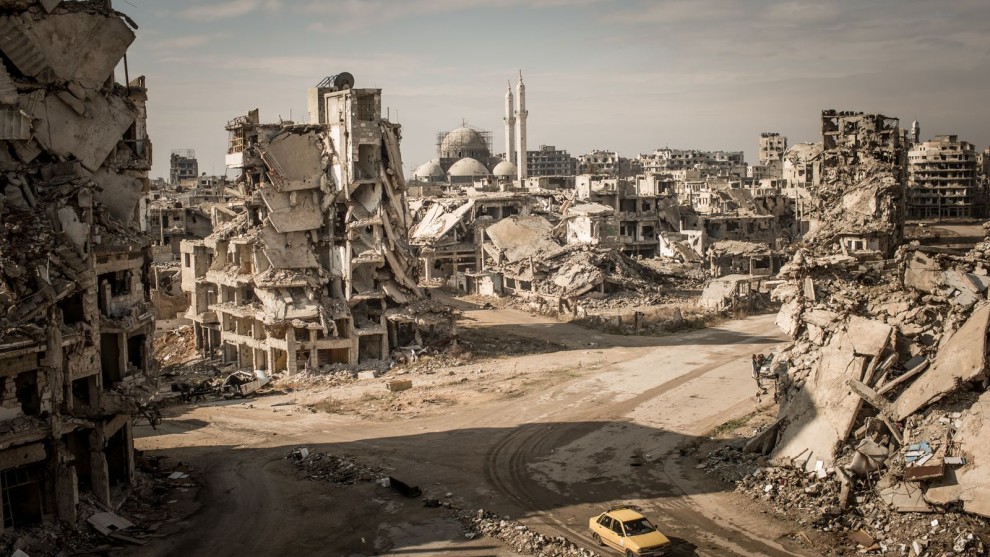 3rd Place in Places. Photograph and caption by Christian Werner / 2018 National Geographic Photo Contest. While on assignment for Der Spiegel, we made a road trip through Syria to document the current situation in major cities. When I first entered the Khalidiya district in Homs, I was shocked. I hadn’t seen such large-scale destruction before, and I had been to many destroyed cities. The area around the Khalidiya district was extremely quiet. No city sounds, cars—nothing. Only the chirping of swallows and the wind.

We walked down the streets of Khalidiya, but the destruction was so large scale that you couldn’t have the big picture from the point of view on the street—you could only manage it with a view from above. To make this image, I asked a Syrian soldier in charge of the area if I could climb onto a ruin. The soldier agreed, allowing me to climb at my own risk. I climbed up the ruins of a former house—which was full of improvised explosive devices—and took the picture.