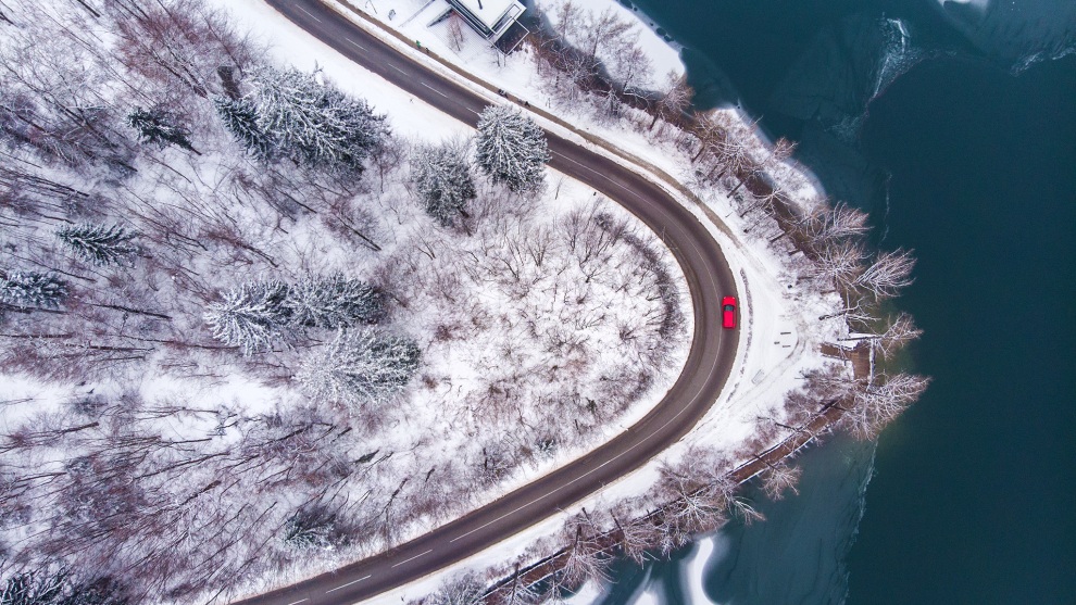 Photographer: Donald Yip, Australia

"An aerial of a road which winds its way around the edge of beautiful Lake Bled, Slovenia. The image was captured in the midst of a deep winter freeze that gripped the entirety of Europe. I loved the shape and curve of the road, and waited patiently for a car to pass on the end of the turn, and to my luck, it was bright red!"