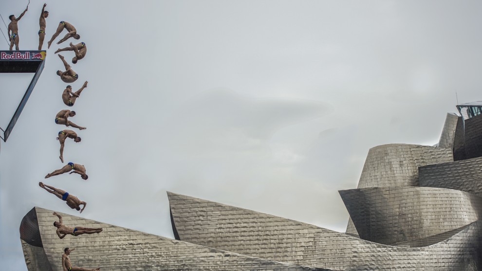 Photographer: Pedro Luis Ajuriaguerra Saiz, Spain

"The diver of the Czech Republic Michal Navrátil makes one of his jumps next to the Guggenheim Bilbao, as part of the RedBull Cliffdiving world series 2018.This image shows the sequence of the complete jump from the platform. It is an image that tells us many aspects. On the one hand, we can appreciate the camaraderie that exists between the jumpers in such a demanding and competitive competition, on the other hand, we can also perceive the interest of the athletes in registering and sharing all the unique moments, perhaps in their networks and profiles with its millions of followers, without a doubt a sample of the digital society 3.0 in which we live."