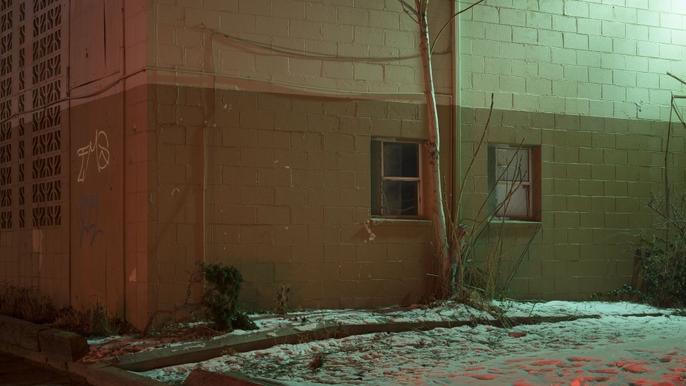 Todd Hido
Aperture

Untitled, #11669-1778. 2016.

“This is a relatively recent image published in Intimate Distance (2016). I shot it in Denver, which is one of my go-to stomping grounds. I have lived in California for about 20 years, and
over time realized how important it is to get out of the sun and into the snow. Denver has plenty of it. There is also that grittiness that I love. This place reminds me of the apartment buildings that I used to deliver papers to on my BMX bike
as a pre-teen. My images address the theme of Crossings in the most basic manner: I bring together exact opposites
on the color wheel, red and green, warm and cool. It’s curious how those foundational basics of color theory are at work here; opposites are attractive together.“