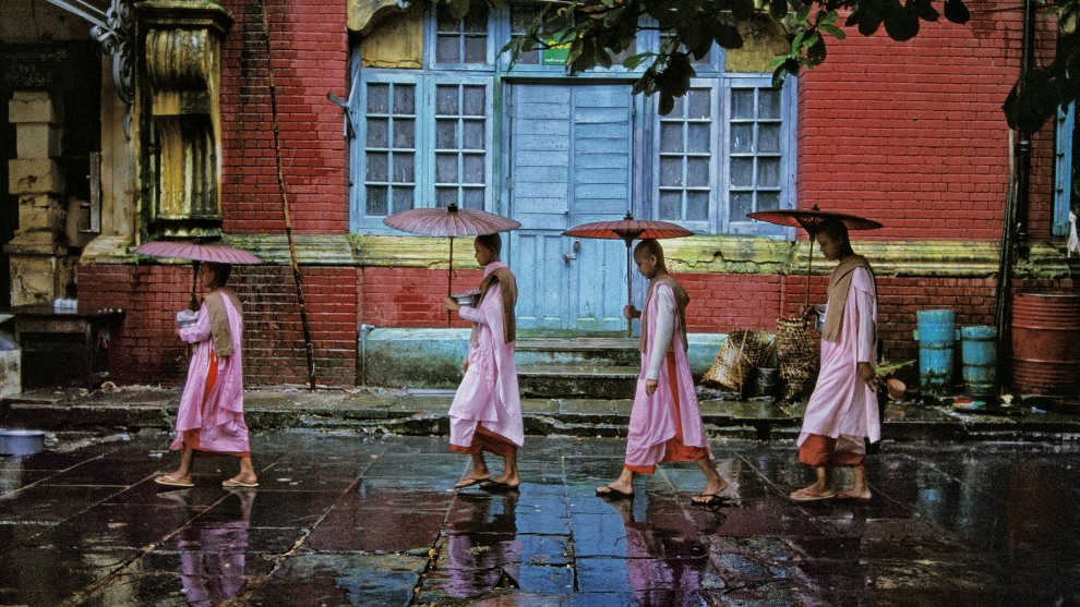 Steve McCurry
Magnum Photos

Procession of nuns. Yangon, Myanmar. 1994.

“I asked a group of Buddhist nuns if I could follow them as   they carried their alms bowls during their rounds through the streets of Yangon, Myanmar. They gather alms and food from local people who donate in order to demonstrate their humility and connection with their Buddhist faith.”