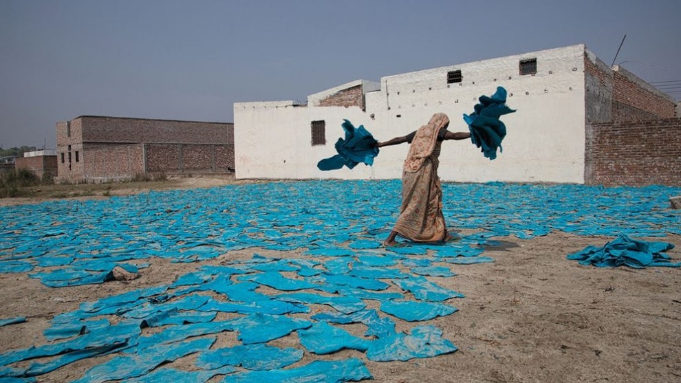 A finalist in the Travel category – a woman at work on the street near a leather factory on the outskirts of Dhaka, Bangladesh (Credit: Erberto Zani)