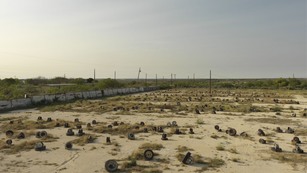 Alec Soth
Magnum Photos

Del Rio, Texas, USA. 2011.

“A fissured, empty, almost lunar landscape–seen from a bird’s- eye view. The camera hovers over it.’ So begins Sam Shepard’s script for one of my all-time favorite films: Paris, Texas,
by Wim Wenders.

I thought of this scene often while photographing from the rooftop of an RV in the border town of Del Rio, Texas. I also thought of the opening lines of dialogue in Paris, Texas. ‘Do you know which side of the border you’re on?’ Looking at the otherworldly landscape from above, this question seems more metaphorical than geographic. The border I’m most interested in crossing is the one between ordinarily life and dreams.”