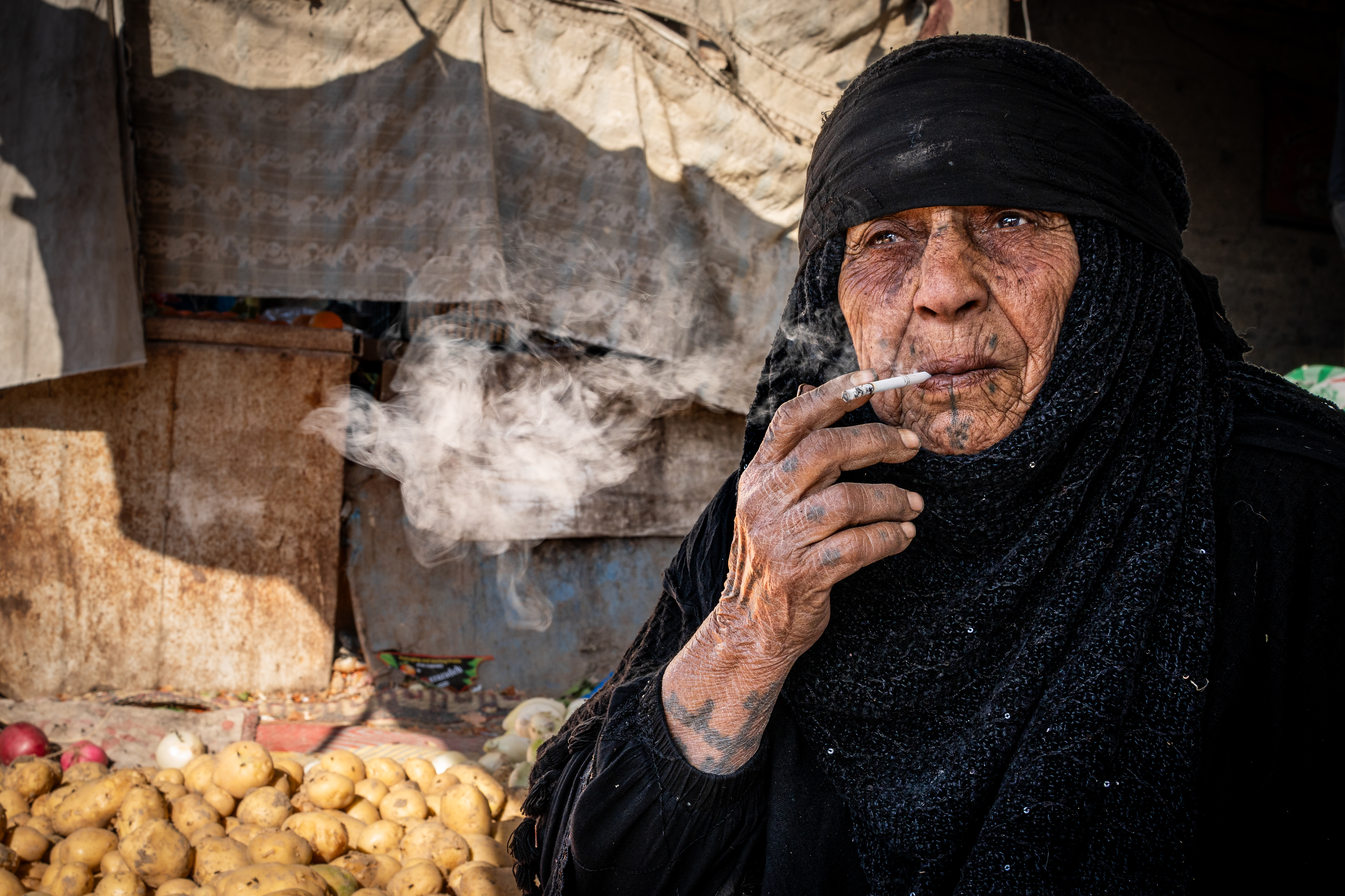 Shot in Nasiriyah, Iraq, this image is the photograph I am most proud of. Her tattoos are the marks of a fading tradition that she may be one of the last to bear. Even her cigarette, which she lit whilst I was buying some potatoes, is a small mark of defiance, adding further texture to her story. It was an enormous honour and privilege to take this photograph. Sony A7C II, Sony 35mm f/1.8 lens. 1/125s @ f11, ISO 200.