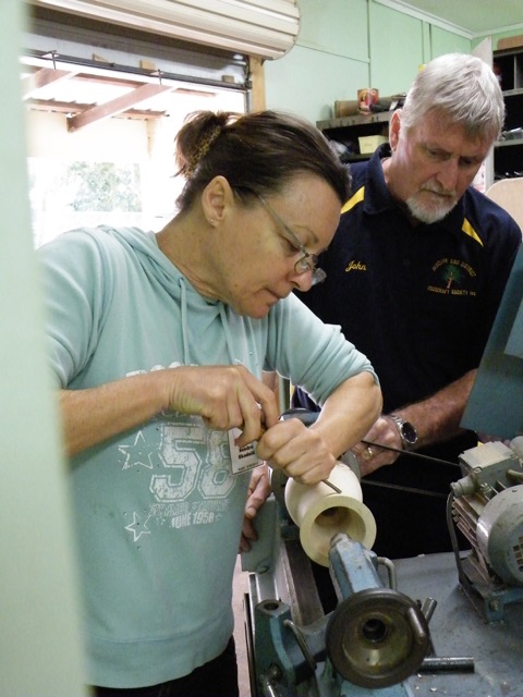 Another photo of woodcarver Sandra Skodnik at work.
