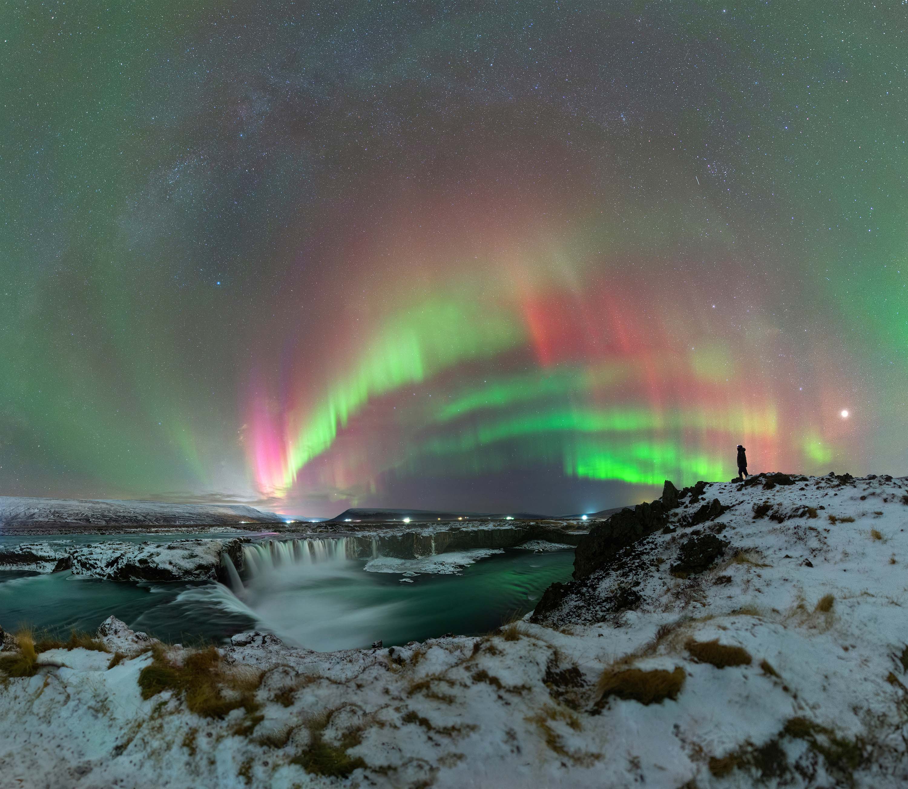 “Aurora Bouquet Above Godafoss” – Martin GiraudGodafoss, IcelandDuring my trip to Iceland, I traveled from the south to the north. The landscapes changed, and snow covered almost everything. Godafoss is a must-see in northern Iceland, literally meaning “the waterfall of the gods.” In the year 1000, Iceland adopted Christianity, and the idols of the old pagan gods were thrown into the falls. This waterfall is one of the most impressive in the country, making us feel incredibly small in its presence.