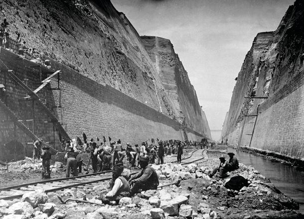 Workmen with the railway at the bottom of the dig.