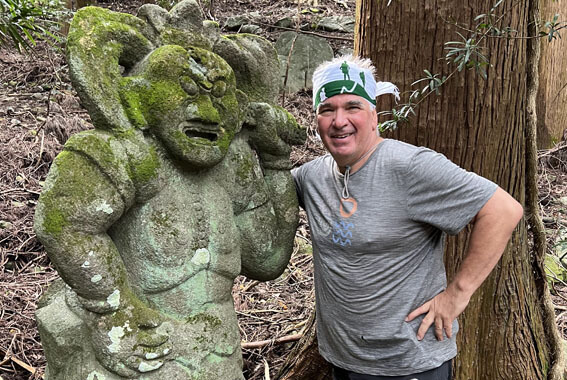 Guest with stone guardian, Kunisaki, Kyushu