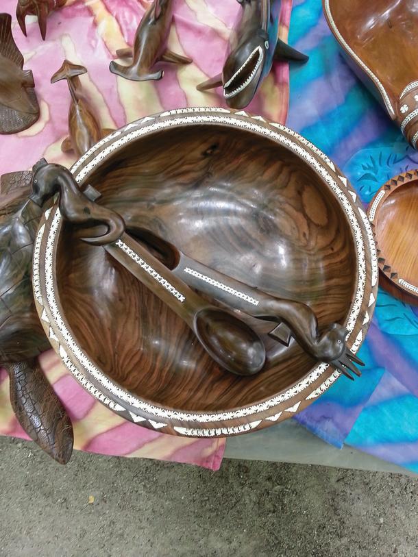Hand carved bowl with nautilus shell inlay.