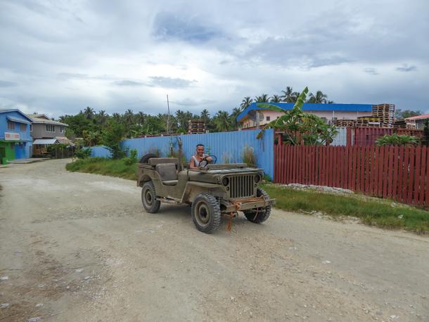 Old jeep roaming the dirt streets of Munda.