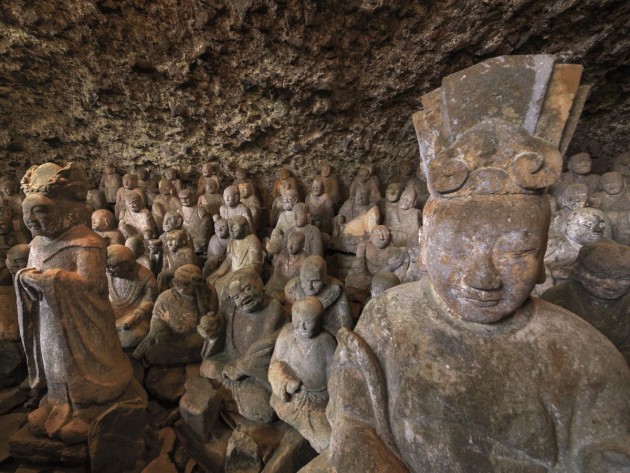 One mountainside temple houses hundreds of stone statues.