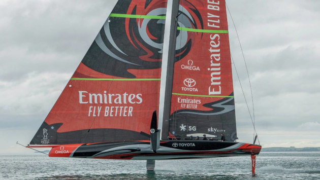 Team New Zealand foil past a 1995 America's Cup boat while training in Auckland.
