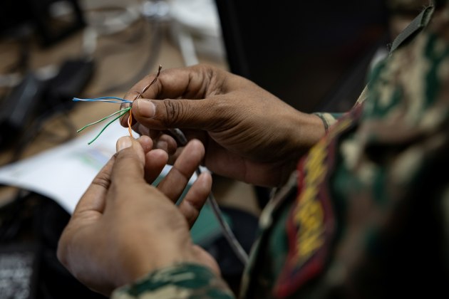 A signaller from the Timor-Leste Defence Force Transmiss&otilde;es Company works on communications cabling during Exercise HARI'I HAMUTUK 2024, in Metinaro Military Base, Timor-Leste.

Credit: Defence