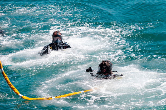 A United States Navy diver and a member of the Australian Navy Clearance Dive Team 4 participate in a joint training exercise at HMAS Stirling, Western Australia. 

Credit: Defence / Able Seaman Jaxsen Shinners