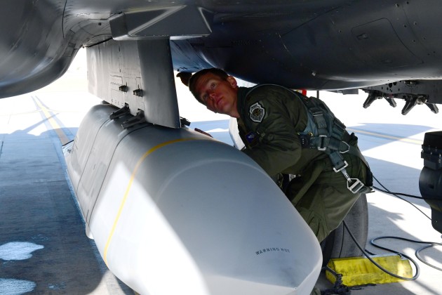 A Major who is the 706th Fighter Squadron assistant director of operations and F-15E test director, prepares to conduct an AGM-158B Joint Air-to-Surface Standoff Missile drop from an F-15E.

Credit: Natalie Stanley / US Defense