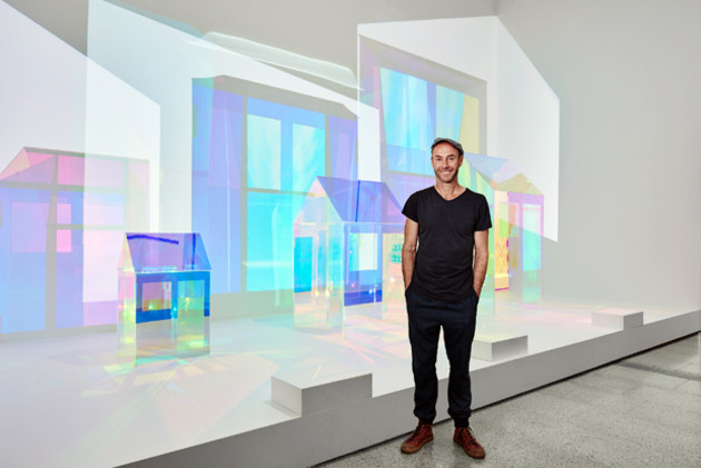 Adam Goodrum (designer) winner of the Rigg Design Prize 2015 in front of his winning work &lsquo;Unfolding&rsquo; Photo: Brooke Holm