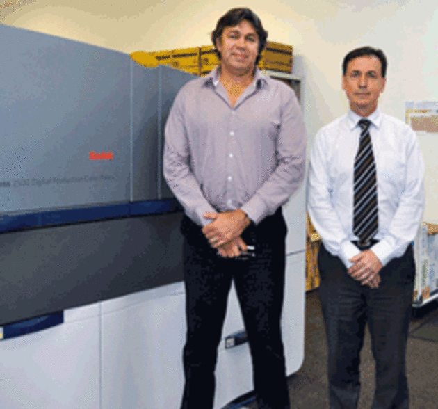 Keeping up with demand: Stewart Alexander and John Bastoni of Academy Photography with the Kodak NexPress 2500.