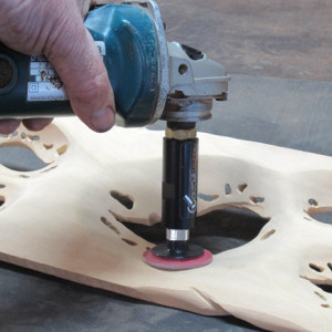 Neil Scobie tests the Arbortech Contour Random Sander on one of his wall pieces.