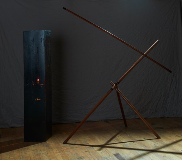 DAMIEN WRIGHT AND BONHULA YUNUPINGU | VIC AND ARNHEM LAND

Bala ga lili is a collaborative cross cultural and cross colonial project with myself Damien Wright of Preston Victoria and Yolngu man Bonhula Yunupingu of Gunyangara Nth East Arnhem land. It consists of two works in constant tension. Wunahakali (The other side) is Bonhula in the act of throwing a spear. Perfectly balanced. Its geometry is the strength and power of the hunter. Its construction referencing Yolngu binding and joinery. The black light house (Gurrnjann Djarratawun Wanga). Made from pitch black 15,000 year old ancient red gum. A stunningly beautiful fortress of European hegemonic rectilinear narcissism. These two objects are charged with versions of power that can never quite reconcile.