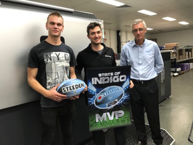 Richard Watson, Currie Group NSW, presents team CMYKhub NSW with their MVP award.