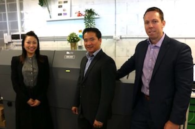'Really delighted': Joanna Lok, SpotOn Finishing (left) with Jimmy Nguyen (centre) and Simon Birch, Neopost.