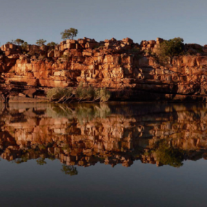 Sandstone escarpments of Sir John Gorge reflected in the Fitzroy River.