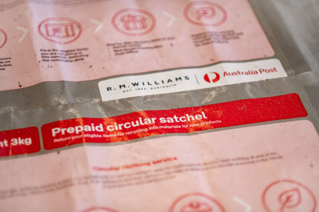 Australia Post’s circular clothing pilot features a satchel made from 100 per cent recycled household soft plastics.