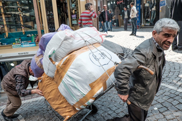 Two porters struggle up a steep cobbled backstreet bellow the Grand Bazaar in Istanbul. Getting close was key here. Fujifilm X-T1, 18-55mm f/2.8-4 lens @ 18mm. 1/180s @ f6.4, ISO 400.