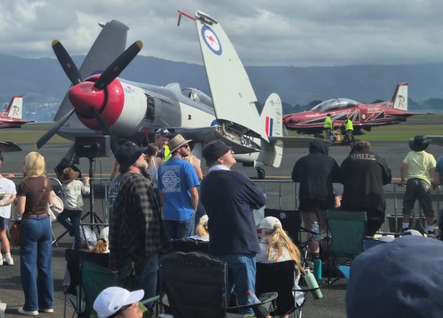 ground crew attend to a Roulettes PC-9 as spectators take in the warbirds static display (Beni McDonald)