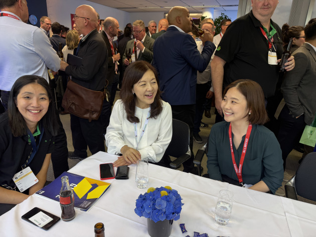 Fonny Chang, Woolworths Group (left) catches up with colleagues.