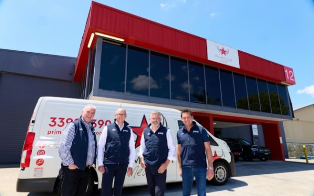 Queensland foodservice wholesaler Prime Cut Meats has been acquired by Andrews Meat Industries (AMI), the family-managed business that forms part of JBS Australia. (L-R: Laurie Marguglio, Michael Andrews, Peter Andrews, and Nick Zanapalis at the Prime Cut Meats facility in Brisbane.) Image: JBS