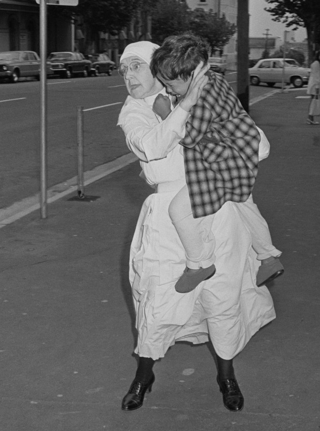 Life and Death Dash, Sydney, 1971. A nurse races this three-year-old boy – he’d taken an overdose of drugs – into St Margaret’s Children’s Hospital at Darlinghurst. Mervyn describes the now iconic image as a classic f8 and be there shot: his 35mm Nikon was loaded with Kodak 400ASA Tri-x black and white film and set to 1/60s @ f8. The image was published on the front page of the Sydney Morning Herald and won him Press Photographer of the Year in 1971, marking a significant turning point in his career.