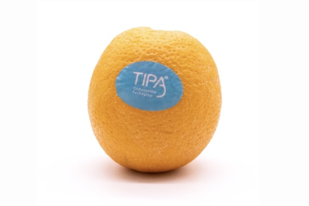 TIPA Compostable Packaging has launched a new certified home compostable label for fresh produce with strong adherence on a variety of produce including the complex, rough skin of an orange.