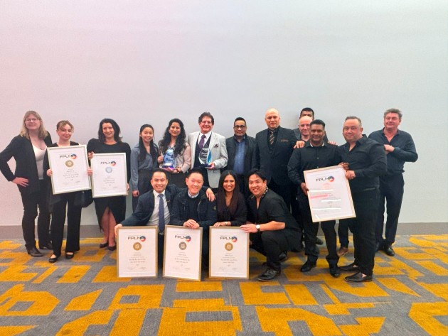 Team effort: Smiles all round for the RollsPack awards win.