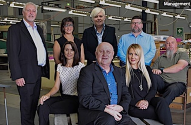 MD Colin Bungate (front, centre) with some of the team at Saunders Print Group.