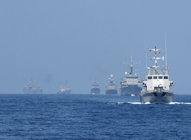 Ships astern of HMAS Childers in a single line formation during Milan 2014, an international maritime activity at the Andaman Islands, India. (Defence)