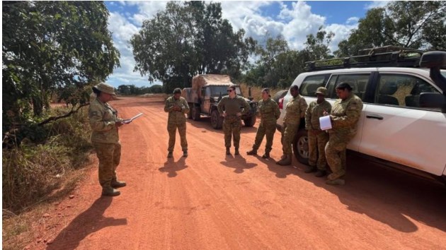 Chief Clerk 51st Battalion Far North Queensland Regiment, Warrant Officer Class Two Anne Schwartz, delivers orders to Yotam Wanch patrol members in the Cape York region of Queensland.

Credit: Defence