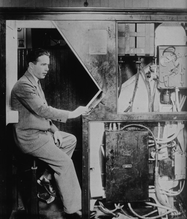 Anatol Josepho inside his photo booth in 1927