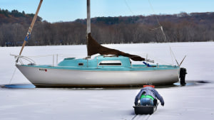 Sailboat frozen in St Croix River may stay out all winter